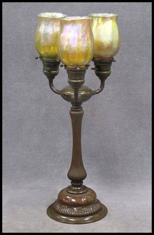 Tiffany Studios bronze Tulip table lamp, signed no. 310 with Tiffany Favrille glass shades. Image courtesy of William J. Jenack Estate Appraisers and Auctioneers.