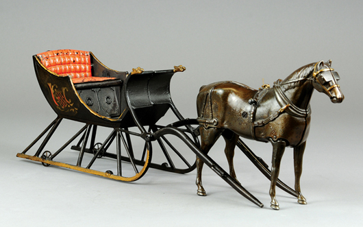 Ives Cutter Sleigh with walking horse, cast iron, 1890s, 22 inches long. Estimate $30,000-$40,000. Bertoia Auctions image.