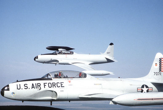 Two T-33s from the 95th Fighter Interceptor Training Squadron in flight near Tyndall AFB, Florida, in 1988. Image courtesy of Wikimedia Commons