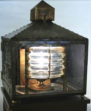 Chance Brothers and Co. Ltd, Birmingham, England, made this lighthouse beacon, which has a stacked Fresnel lens in bronze frame in a heavy steel case. It is dated 1893. Image courtesy of LiveAuctioneers Archive and Kaminski Auctions.