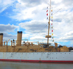 The USS Olympia on display as a museum ship on the Delaware River near Penn's Landing, Philadelphia. 2007 photo by Jan's Cat. licensed under the Creative Commons Attribution 2.0 Generic license.