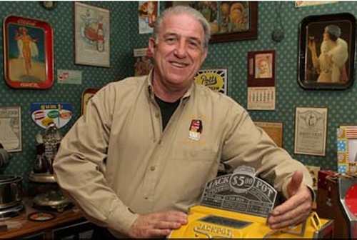 Bob Levy with a prized $5 jackpot coin-op machine. The late Mr. Levy's collection will be auctioned by Morphy's on Sept. 3, 2011. Image courtesy of Morphy Auctions.