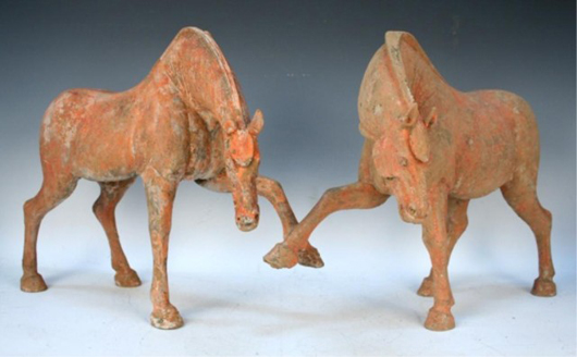 A pair of Tang horses with traces of light red pigment has an estimate of  $18,000-$20,000. Image courtesy of Showplace Antique & Design Center.