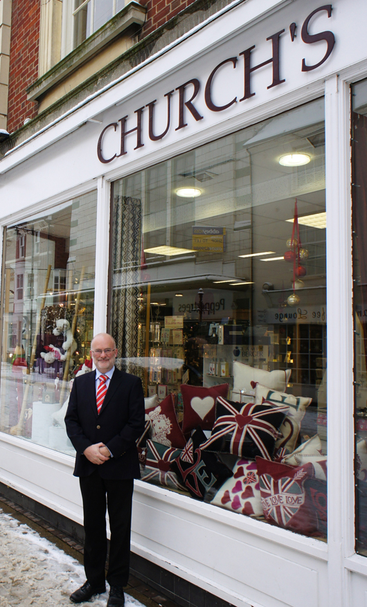 Stephen Church, standing outside his Church’s China store in Northampton, describes the interest in royal wedding souvenirs as ‘quite staggering.’ Image courtesy of The U.K. Gift Company.