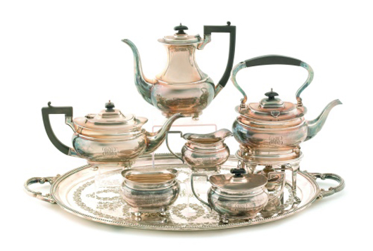 Birmingham six-piece sterling silver tea and coffee service, cairca 1937, bearing the maker's mark 'W.A.,' with a silver-plated tray: $3,555. Image courtesy of Pook & Pook Inc.
