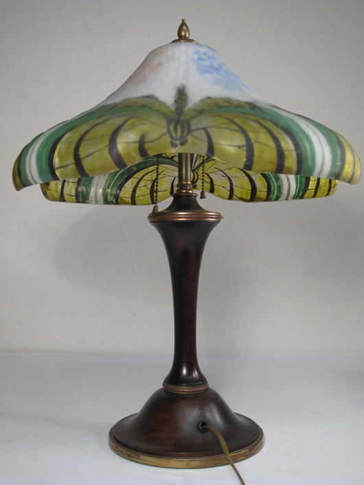 Pairpoint Puffy reverse-painted table lamp, 22 inches tall, “quilted” shade with butterflies, estimate $5,000-$7,000. Auctions Neapolitan image.