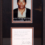 O.J. Simpson’s 1994 mug shot, framed with an autograph of his attorney Johnny Cochran. Image courtesy of LiveAuctioneers and DuMouchelles.