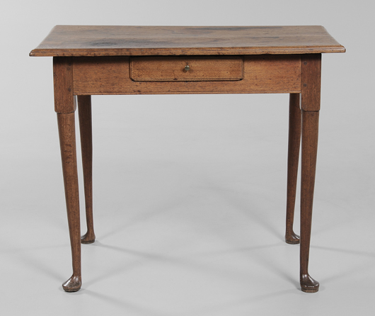 This walnut table was one of 14 lots deaccessioned from the Museum of Early Southern Decorative Arts to benefit the acquisition fund. It has a two-board top, molded edge, single dovetailed drawer on turned legs with pad feet. It raised for $26,400 (est. $2,000-$3,000). Image courtesy of Brunk Auctions.