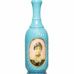 This powder blue milk glass barber's bottle was offered for sale in a 2010 online auction by Glass Works Auctions of East Greenville, Pa. It was made in about 1910, is 10 3/4 inches tall and has its original metal neckband and screw cap. Its estimated value is $500 to $700.
