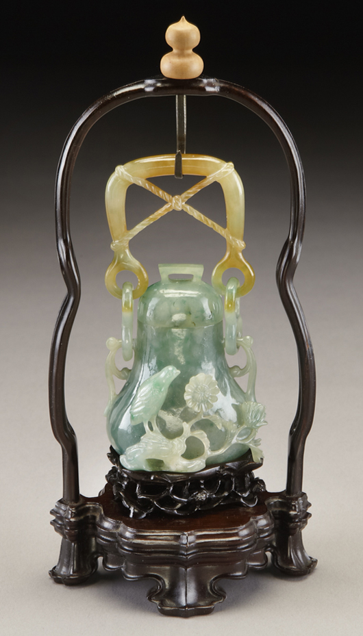 Chinese Qing carved jadeite hanging vase depicting quail, with original box. Jade: 3.5 inches high, overall: 7.25 inches high, circa 19th century. Price realized: $36,750. Image courtesy of Dallas Aucton Gallery.