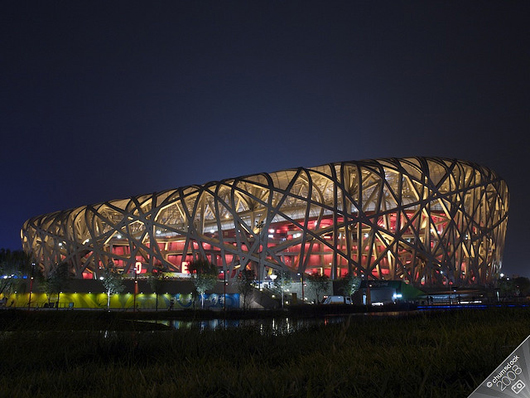 The Beijing National Stadium known as the Birds' Nest, designed collaboratively by Ai Weiwei and the Swiss firm Herzog & de Meuron. Aug. 20, 2008 photo by Chumsdock Cheng. Licensed under the Creative Commons Attribution-Share Alike 2.0 Generic License.