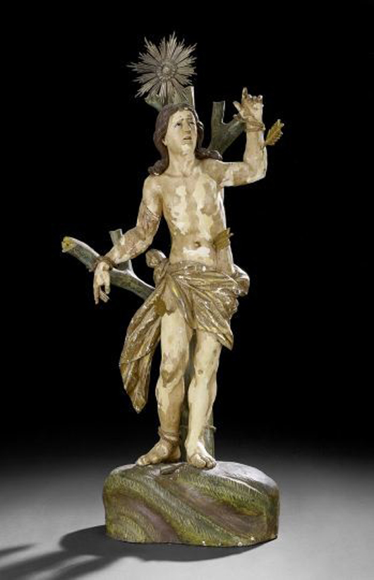 Large Continental carved and gessoed wood statue of St. Sebastian, estimate $3,000-$5,000. New Orleans Auction Galleries image.