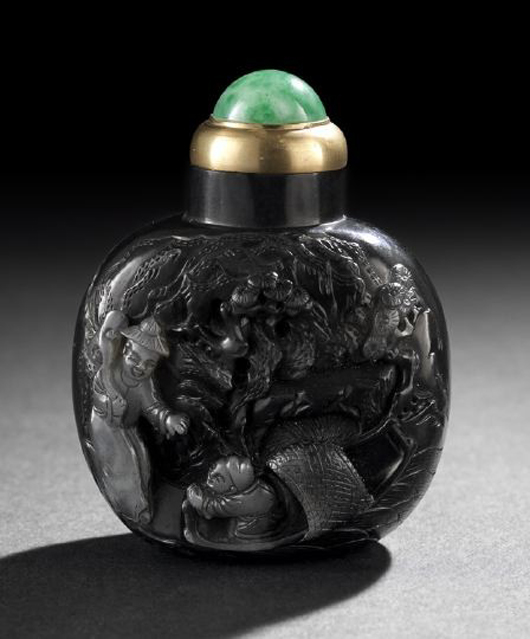 Large Chinese carved black and white jade snuff bottle, estimate $8,000-$12,000. New Orleans Auction Galleries image.