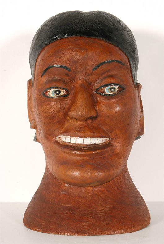 Carved, stained and painted wood creation by S.L. Jones, titled ‘Dark Head Bust with Blue Eyes.’ Image courtesy of Slotin Auction.