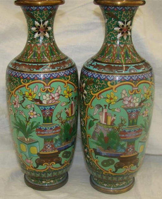 Enamel and cloisonne vases, highly decorative motif, 12 1/8 inches tall. Est. $4,000-$6,000 the pair. Image courtesy of Professional Appraisers & Liquidators.