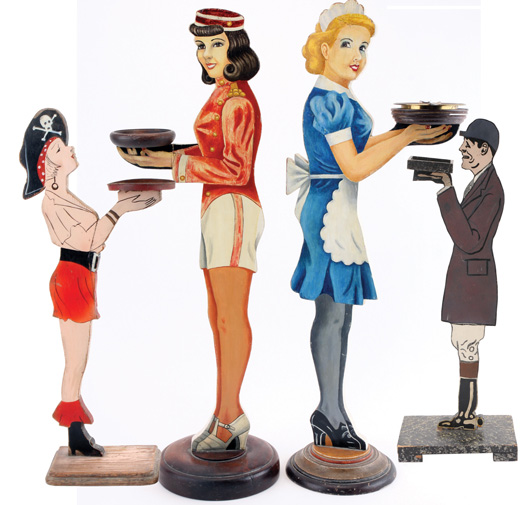 Several examples from a large and diverse collection of figural ashtray stands known as “smoking butlers.” Noel Barrett Auctions image.