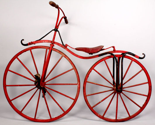 An early French boneshaker, one of several antique bicycles from a lifetime collection featured in the sale. Estimate: $1,500-$2,500. Image courtesy of Case Antiques Inc. Auction & Appraisals.