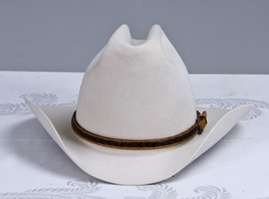 Cowboy hat manufactured by Resistol and retailed by Nudies, North Hollywood. Provenance: Estate of Gene Autry, est. $200-$400.