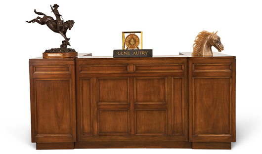 Custom walnut office desk from the Estate of Gene Autry, est. $4,000-$6,000. Abell Auction image.