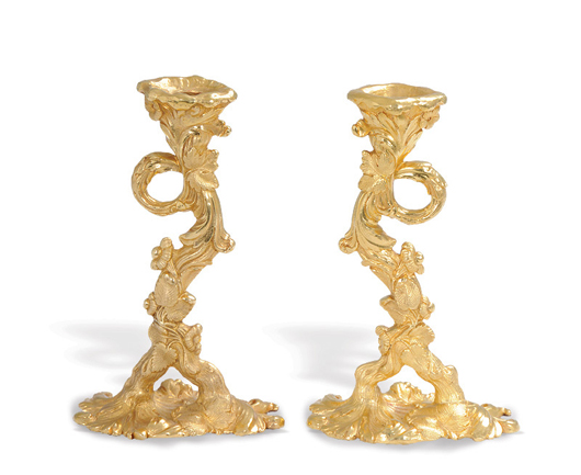 Pair of 18K yellow gold candlesticks, total weight 198.07 troy oz., est. $200,000- $250,000. Abell Auction image.
