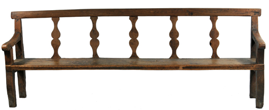 Old wormholes attest to the age of this French provincial long bench. Estimate: $500-$800. Image courtesy of Gray’s Auctioneers.