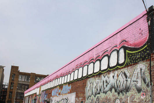 The outside wall of the Fresh Factory bears a Sweet Toof grin. Photo by Kelsey Savage Hayes.