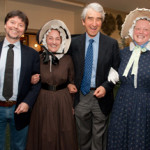 Ken Burns and Sam Waterston join arms with costumed interpreters of Old Sturbridge Village. Image courtesy of Old Sturbridge Village.