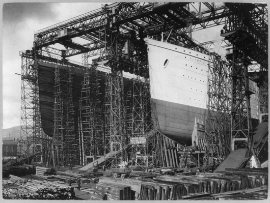 The RMS Olympic and RMS Titanic were under construction at the same shipyard in Belfast, Ireland, circa. 1910. Image courtesy of Wikimedia Commons.
