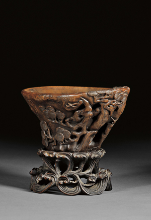 Rhinoceros horn libation cup, China, 18th century, 3 3/8 inches high, 6 3/8 inches long. Estimate: $5,000-$7,000. Image courtesy of Skinner Inc.