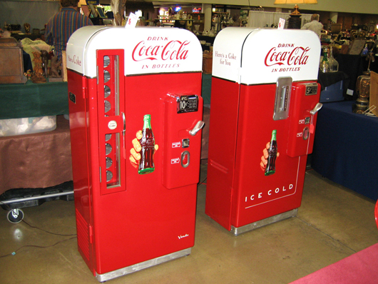 Greg Biaggi of Jupiter, Fla., sold the 1949 5-cent Coca-Cola vending machine (right) priced at $6,800. All he had left on Sunday afternoon was the 10-cent Coke machine from 1953 priced at $5,800. Image courtesy of the West Palm Beach Antiques Festival.