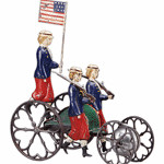 This clockwork bell toy shows a rider waving a flag while standing on a parade vehicle. It sold at a 2010 James D. Julia auction in Fairfield, Maine, for $7,475.
