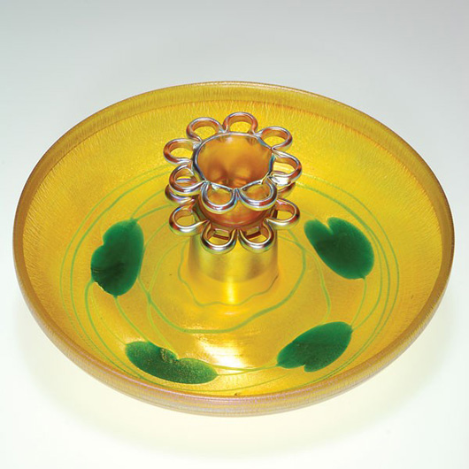 Tiffany glass 10-inch bowl with flower frog. Engraved 'Louis C. Tiffany Furnaces Inc. Favrile' and the number 1790-8553 M. Estimate: $1,500-$2,000. Image courtesy of Humler and Nolan.