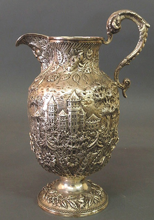 Sterling silver ewer with a repoussé decorated castle and pagoda pattern with vines and flowers, finely chased handle and the spout in the form of a bearded man, 12 inches high, 41 troy ounces. Estimate: $5,000-$7,000. Image courtesy of Wiederseim Associates Inc.