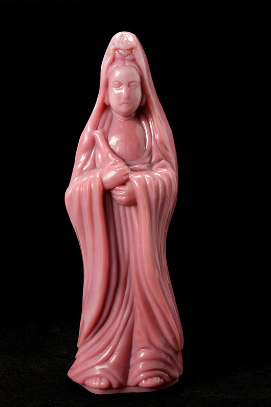 An unusual opaque pink glass standing guanyin, 18th century. Estimate: $5,000-$7,000. Image courtesy of Michaan’s Auctions.