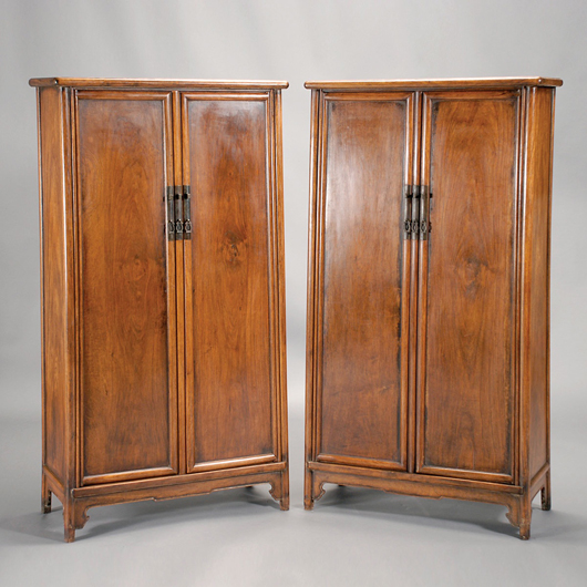 Pair of Huanghuali and mixed wood round-corner tapered cabinets, Yuanjiaogui, late Qing Dynasty. Estimate: $12,000-$18,000. Image courtesy of Michaan’s Auctions.