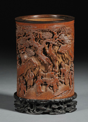 Bamboo brush pot, China, 18th century, carved with Immortals in a mountainous landscape, ht. 6 inches. Sold for $539,500. Image courtesy of LiveAuctioneers.com Archive and Skinner Inc.