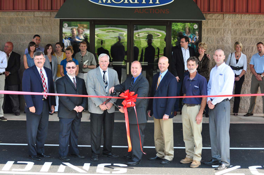 Dan Morphy (center) cuts the ribbon to officially launch the newly expanded Morphy Auctions gallery in Denver, Pa. Honored guests included (left to right): Michael Callahan, president of Benchmark Construction Co.; Matt Mack, engineering manager Ludgate Engineering Corp.; architect Eldon R. Stoltzfus of Althouse, Martin & Associates; (Morphy), Troy Hafer, project superintendent Benchmark Construction Co.; and Fred Kurtz, project supervisor. At far right is Morphy Auctions general manager Kris Lee. Morphy Auctions image.