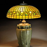 Bigelow & Kennard table lamp with Grueby Faience Co. base, Boston, circa. 1904, 24 1/2 inches high. Estimate: $25,000-$35,000. Image courtesy of Skinner Inc.