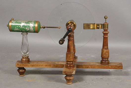 A nifty gadget, this electrostatic machine with glass disc and tole canister, circa 1910, brought $600 in April. Image courtesy Kamelot Auctions, Philadelphia.