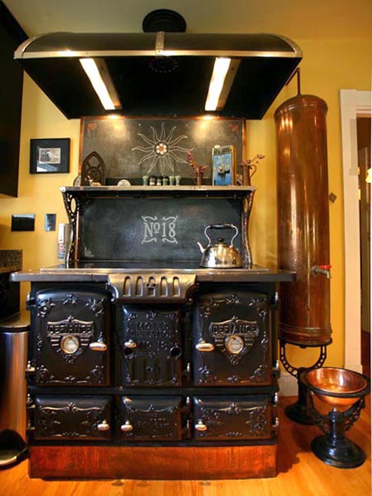 Bruce and Melanie Rosenbaum began steampunking as they were restoring their 1901 house in Sharon, Mass., and now share their expertise through their website www.modvic.com. In their kitchen, a modified 1890s J.L. Defiance stove has been updated with a glass cooktop and double ovens where the wood once burned. Image courtesy ModVic.