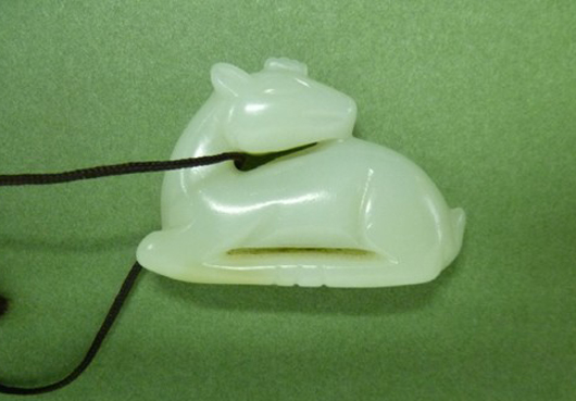 Jade amulet formed as deer, possibly from Palace workshop, Qianlong period, 18th century high style, est. $5,000-$7,000. Asian Antiques Gallery image. Asian Antiques Gallery image.