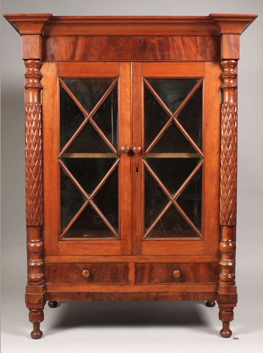 A miniature Southern cherry Classical press with two glazed doors sold for $17,825 (est. $1,800-2,200). Image courtesy of Case Antiques.