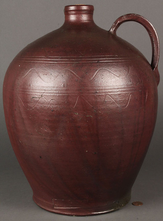 This sine wave stoneware jug, marked ‘J. Mort,’ from a previously unrepresented family of Tennessee potters, reached $23,000. Image courtesy of Case Antiques.