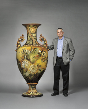 Royal Doulton with Stuart - Stuart Slavid, director of Skinner’s European Furniture and Decorative Arts department stands next to a circa-1893 Doulton Lambeth faience floor vase, 75 1/2 inches tall. Estimate $20,000-$30,000. Image courtesy of Skinner Inc.