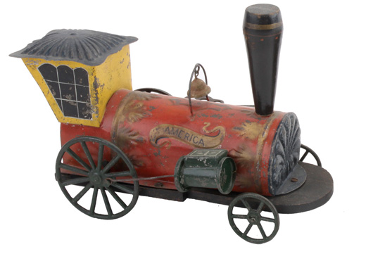 19th-century Hull & Stafford 'America' clockwork locomotive, painted and stenciled tin and wood, ex Ward Kimball collection, $11,800. Noel Barrett Auctions image.