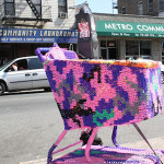 Even before entering the store, a yarn-covered shopping cart by crochet-enthusiast Olek welcomes visitors. Photo by Kelsey Savage Hays.