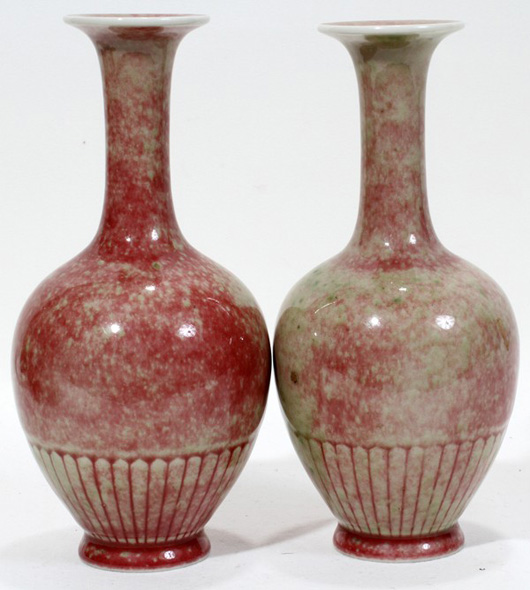 Pair of Chinese Peach Bloom porcelain vases, 8 inches high, decorated with a chrysanthemum pattern, each having an under glaze blue apocryphal six-character Kangxi mark at the underside. Estimate: $3,000-$4,000. Image courtesy of DuMouchelles.