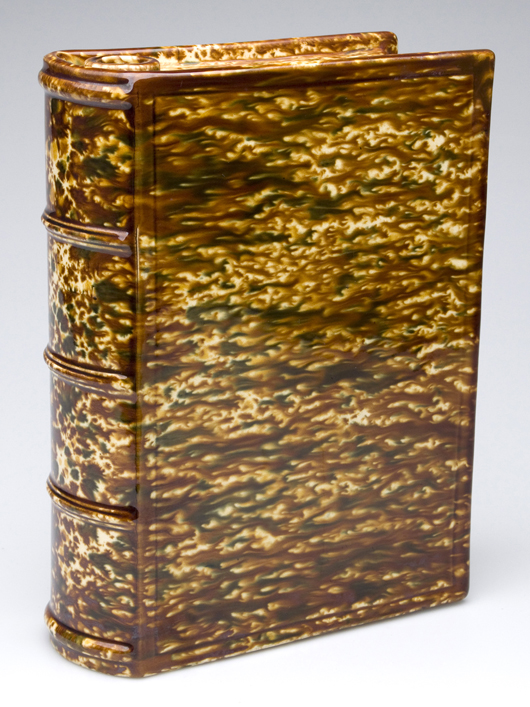 Bennington pottery large-size book flask $4,312. Image courtesy of Jeffrey S. Evans & Associates Inc.