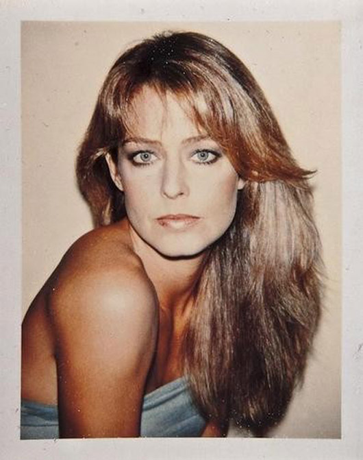 Farrah Fawcett is pictured in a Polaroid color print by Andy Warhol.  Image courtesy of LiveAuctioneers Archive and Bloomsbury Auctions.