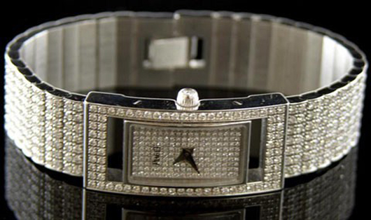 Piaget 18K white gold rectangular wristwatch with numerous small round diamonds, retains original box, est. $30,000-$50,000. Image courtesy of Crescent City Auction Gallery.